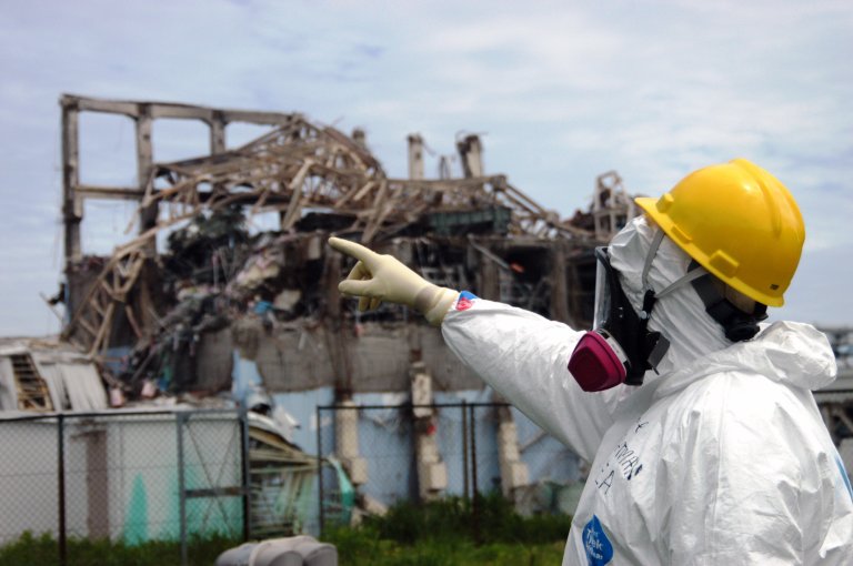 investigator examines Reactor Unit 3 at the damaged Fukushima Daiichi plant