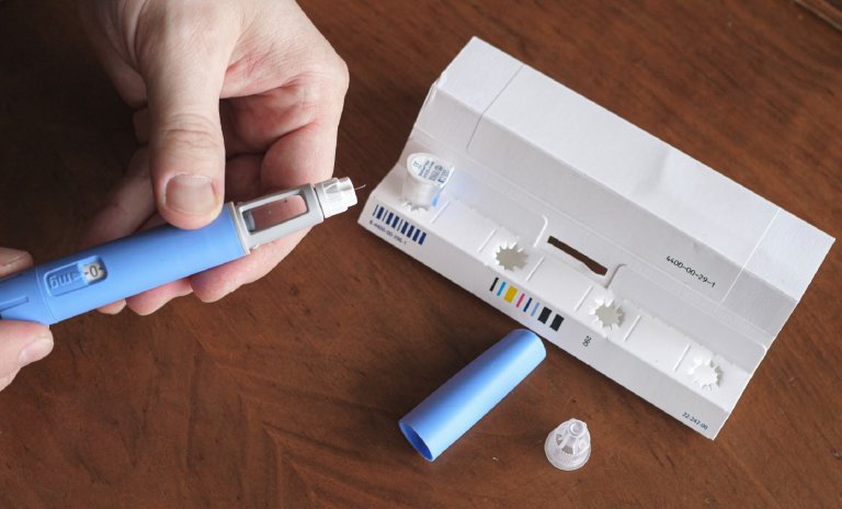 Ozempic diabetes drug pen being taken out of package following TikTok weight loss trend