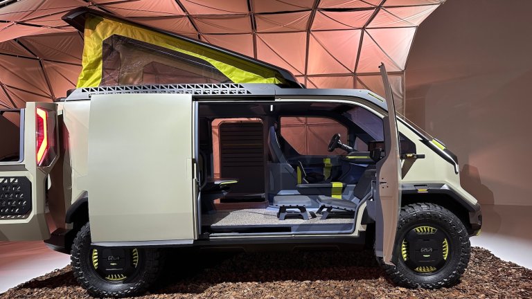 camper van vehicle with tent on top